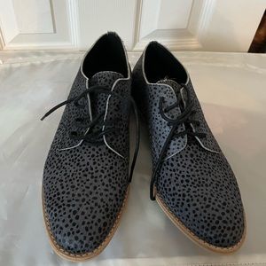 Size 40.5 shoes with dot/animal print. Never worn.
